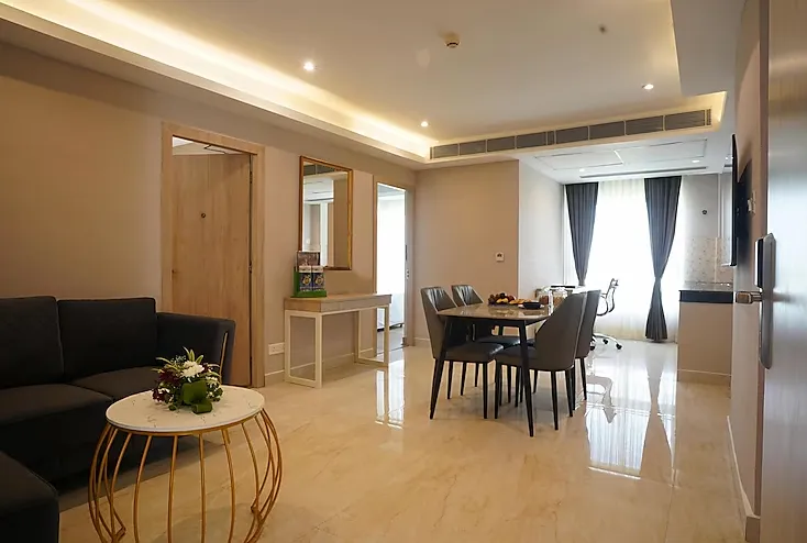 Modern guest room at Sarovar Portico, Kolkata with comfortable bedding