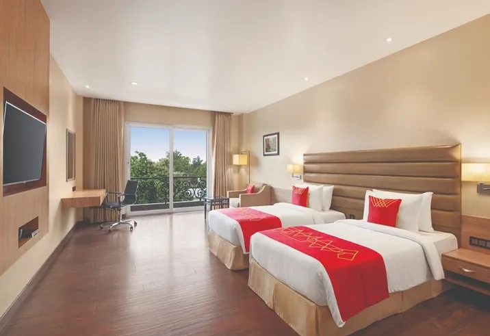 Executive room at Ramada By Wyndham Aligarh GT Road Agra with premium bedding, refined interiors, and enhanced comfort details