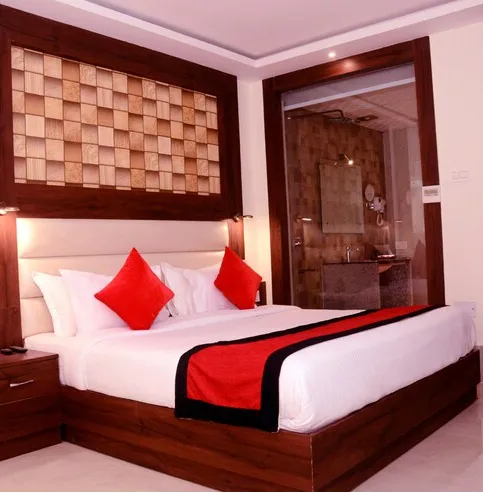 Standard room at 8fold by LaRiSa Basti with neatly arranged bed, side tables, soft lighting, and minimal décor