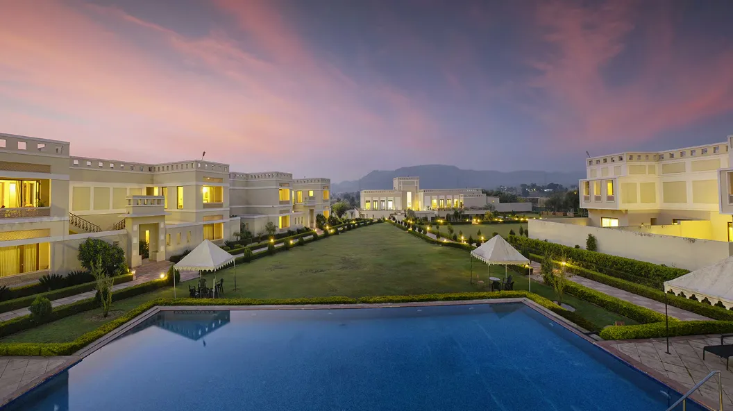 Swimming pool at Achrol Niwas Jaipur with surrounding deck and open outdoor setting