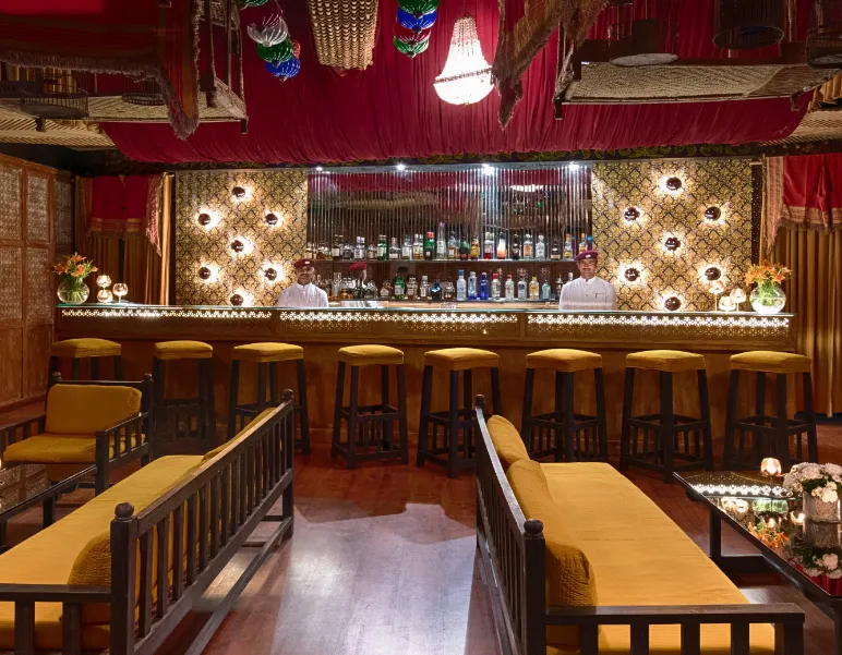 Restaurant at Ajit Bhawan - A Heritage Resort Jodhpur showing dining tables and interior setting