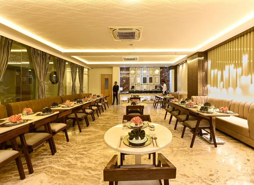 Restaurant at Hotel Avalon Palms Agra featuring dining tables and ambient lighting