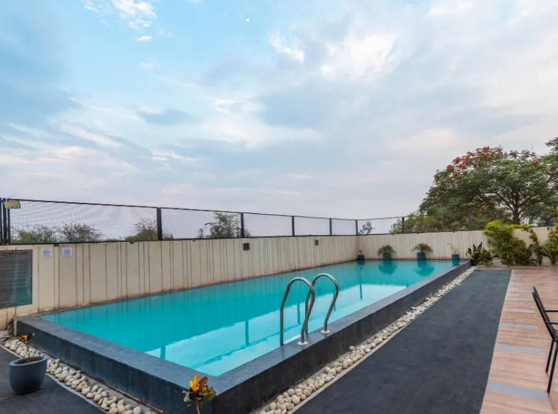 Hotel entrance of ClarksInn Suites Jaipur with exterior façade and driveway access