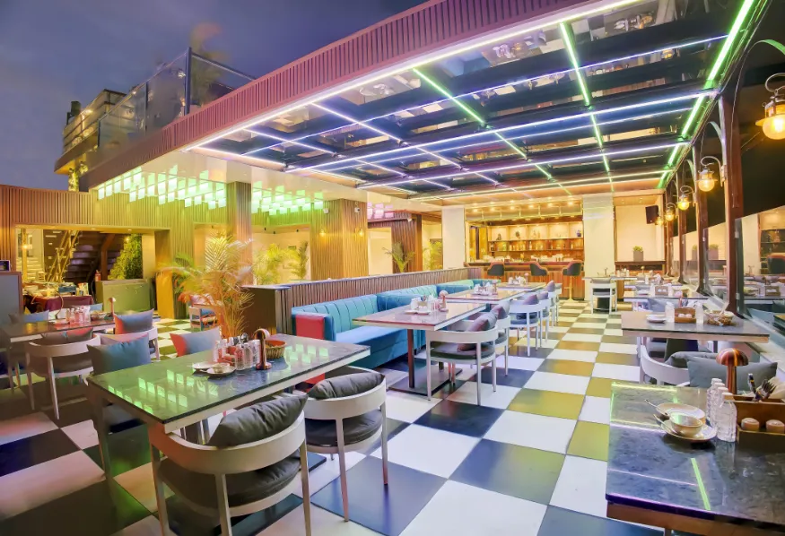 Restaurant at Cygnett Inn Airport Jaipur showing dining tables and interior décor