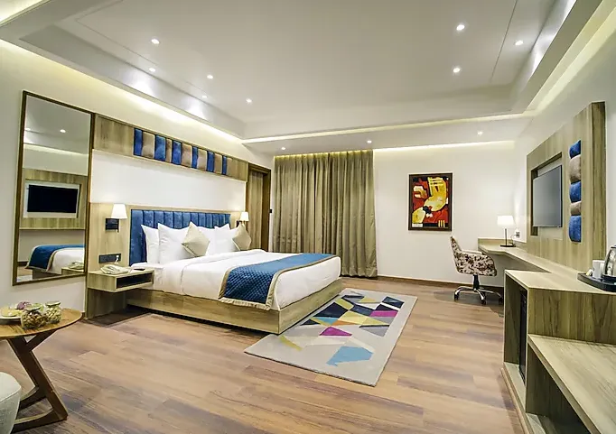 Suite room at Cygnett Style Ganga Jaipur with separate seating and restful design