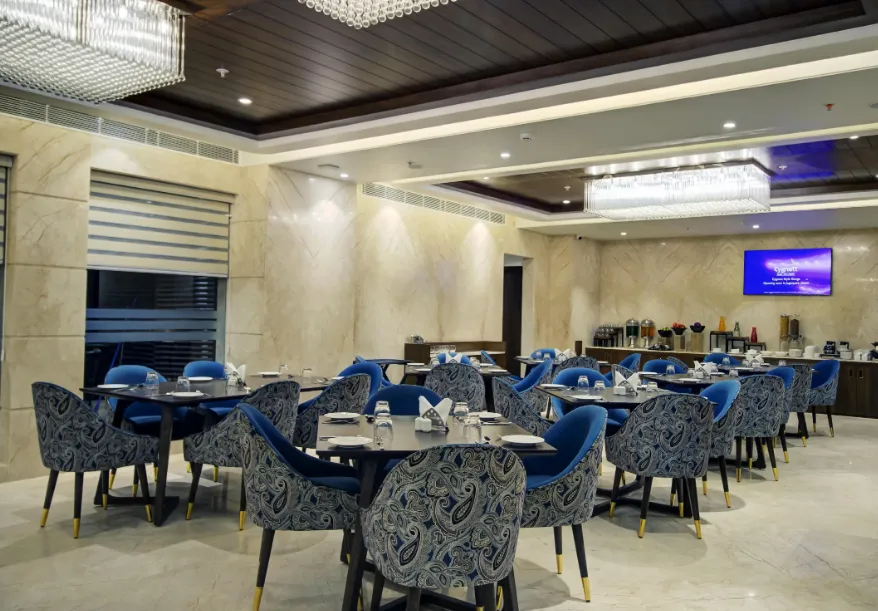 Restaurant at Cygnett Style Ganga Jaipur with dining tables and indoor décor