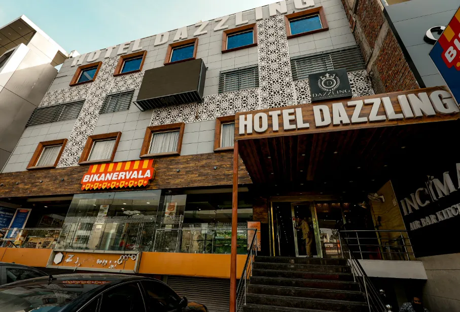 Entrance view of Dazzling Hotel and Resorts Agra showing exterior structure and driveway approach