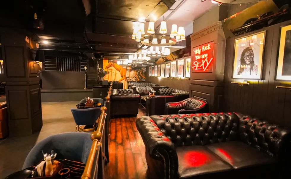 Restaurant at Dazzling Hotel and Resorts Agra with dining tables, chairs, and ambient lighting