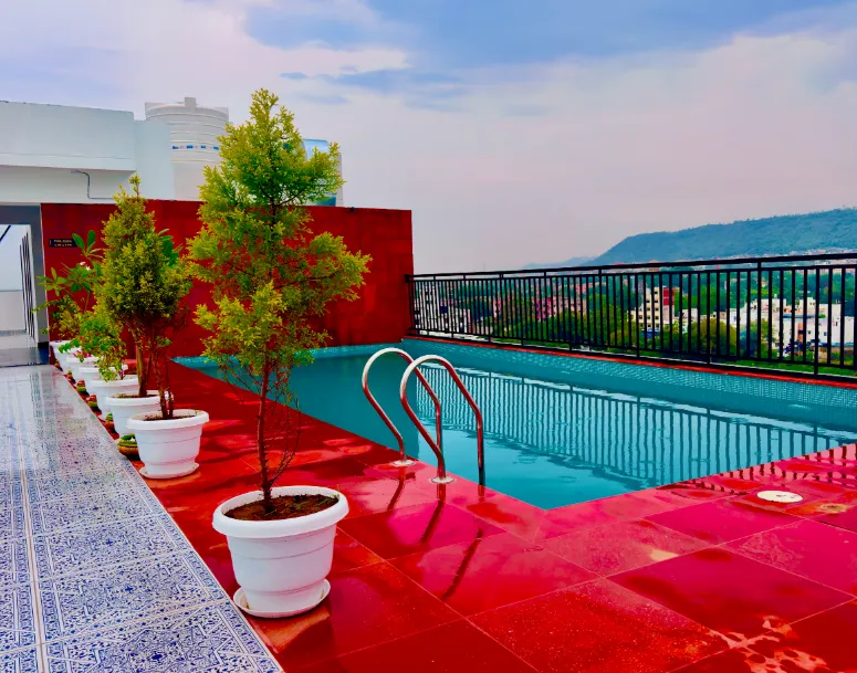 Restaurant area at Dé glance Udaipur showing dining tables and interior decor