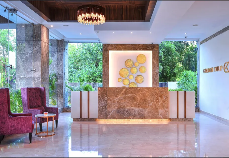 Entrance of Golden Tulip Agra displaying hotel façade, signage, and driveway access