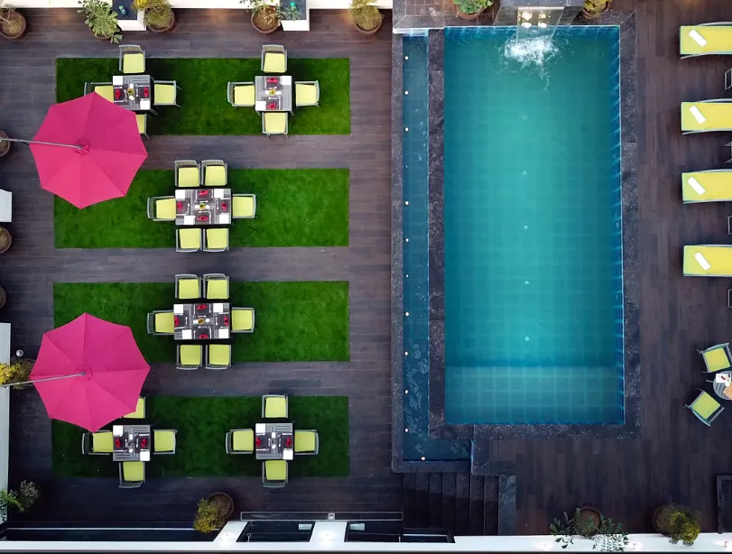 Swimming pool at Golden Tulip Agra showing pool area, deck space, and surrounding structure