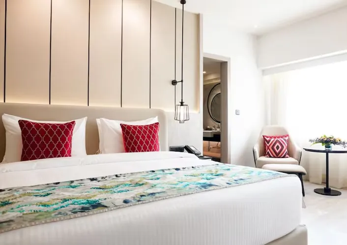 club premium room at Golden Tulip Lucknow with added seating space and modern room design