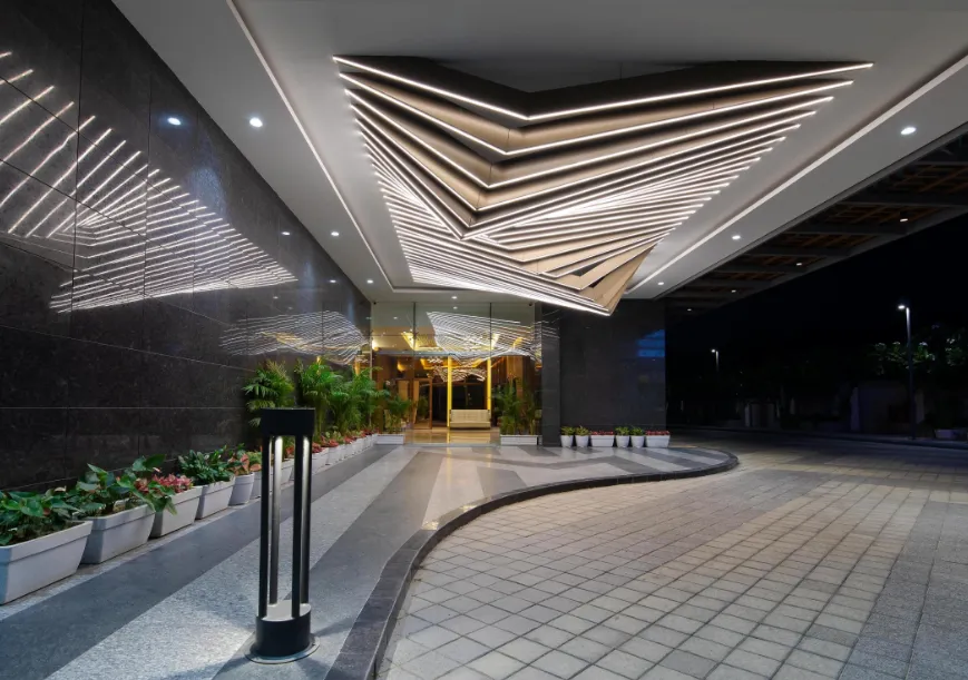 Hotel entrance of Hometel Alambagh Lucknow displaying building façade and driveway access