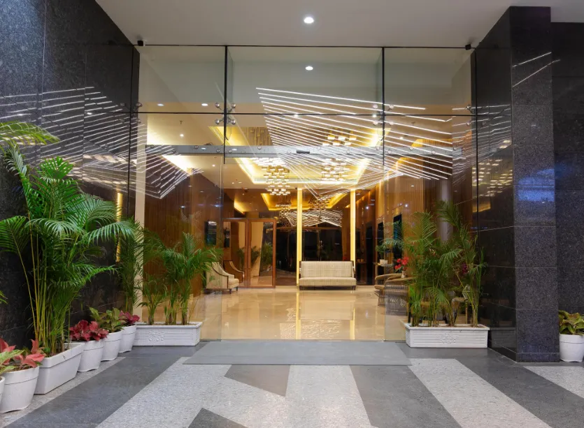 Hotel entrance of Hometel Alambagh Lucknow displaying building façade and driveway access