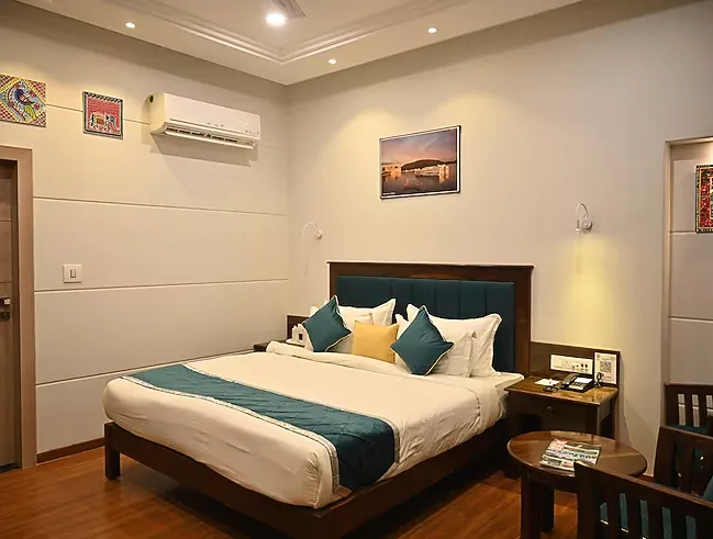 Studio suite at Hotel Chirag Bikaner with separate sleeping area and spacious room layout