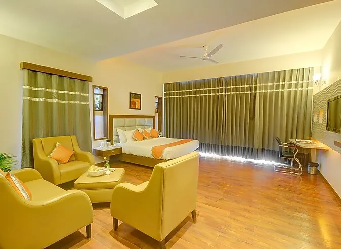 Studio suite at Hotel Chirag Bikaner with separate sleeping area and spacious room layout