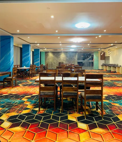 Restaurant at Hotel Ekana Jagatpura Jaipur showing dining tables and indoor service area