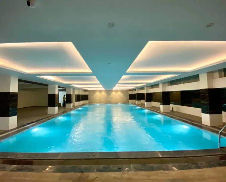 Open swimming pool area at Hotel Ekana Jagatpura Jaipur within the hotel premises