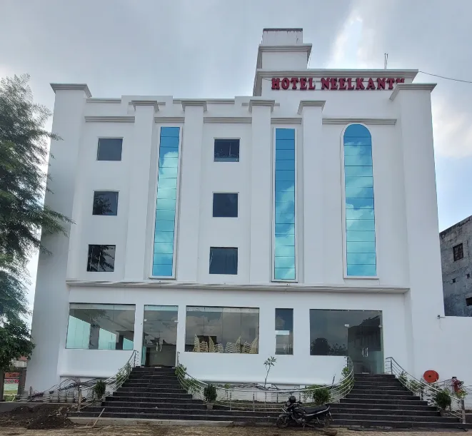 Exterior entrance of Hotel Neelkanth Ayodhya with building façade and access pathway
