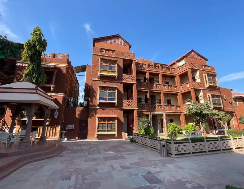 Exterior entrance of Hotel Nirali Dhani Jodhpur with visible driveway and signage
