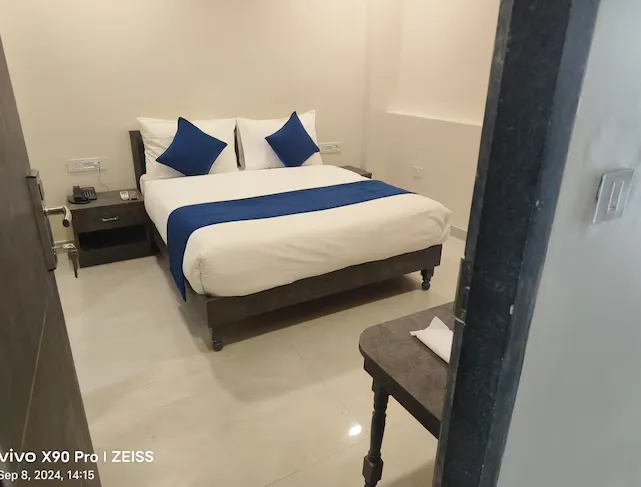 Deluxe room at Hotel RoyalOcean Prime Jaipur showing larger layout and seating area