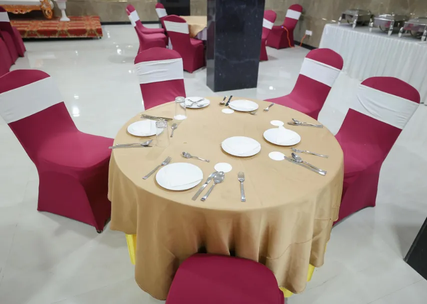 Restaurant at Hotel RoyalOcean Prime Jaipur featuring dining tables and indoor décor