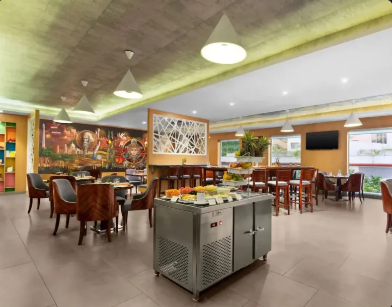 In-house restaurant at Howard Johnson by Wyndham, Kolkata Airport with modern dining setup