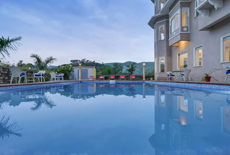 Restaurant interior at Jag Aravali Udaipur showing dining tables, chair setup, and serving area