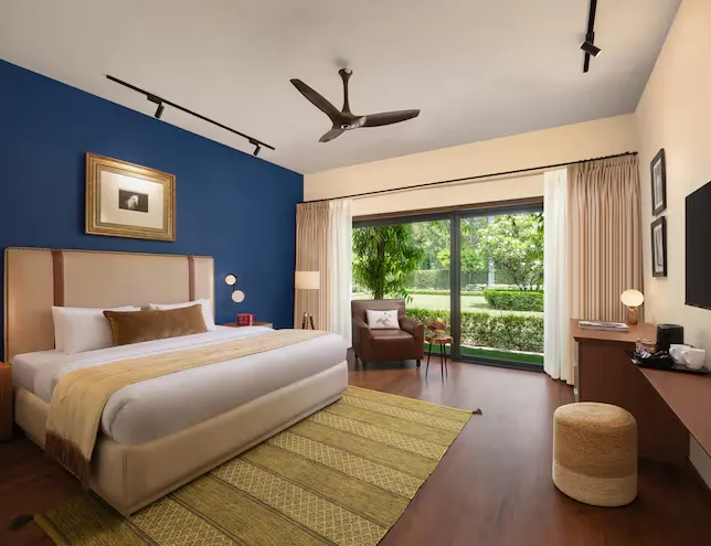 premium room at Modi Estate - AM Hotel Kollection Meerut featuring refined décor and relaxed seating area