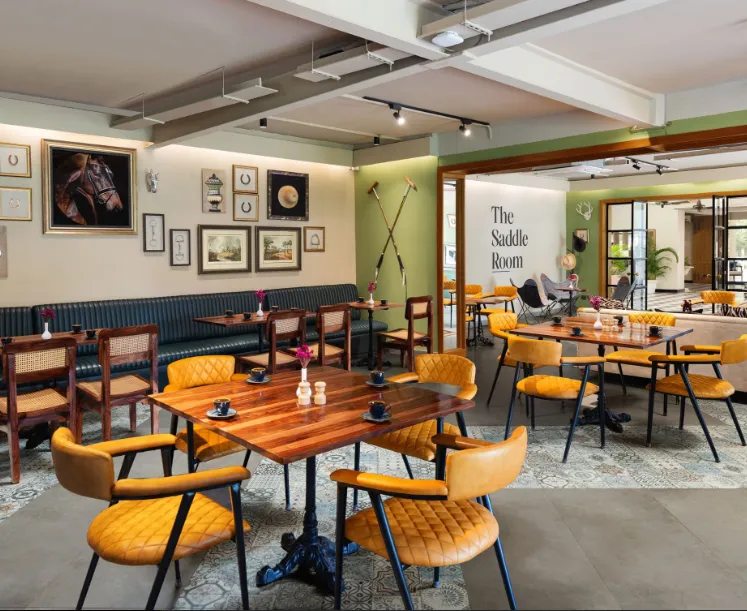 Restaurant at Modi Estate - AM Hotel Kollection Meerut showing dining tables and interior setup