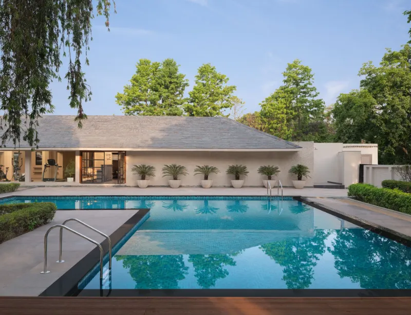 Swimming pool at Modi Estate - AM Hotel Kollection Meerut showing poolside area and water layout