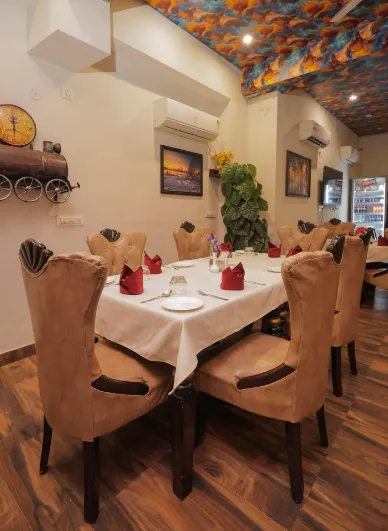 Restaurant at NANDAN RETREAT Vrindavan displaying dining tables and indoor seating arrangement