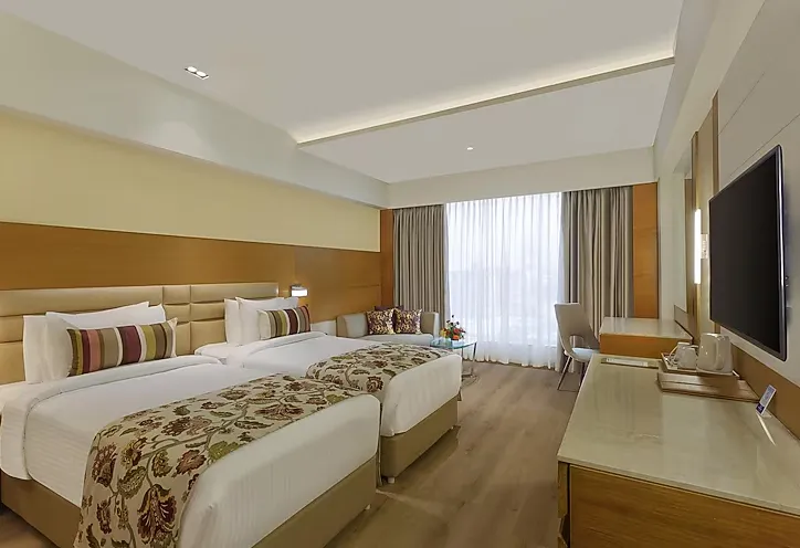 Superior room at Nataraj Sarovar Portico-Jhansi Gorakhpur with comfortable bedding and functional room design