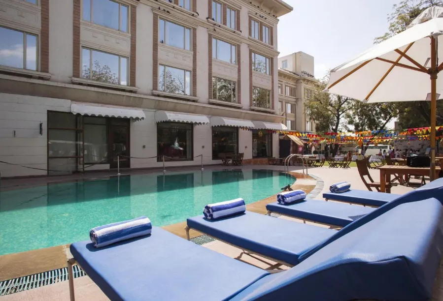 Outdoor swimming pool at Park Plaza Jodhpur with poolside seating and clear water