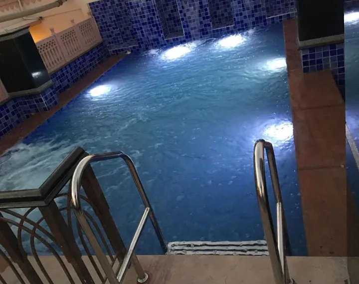 Swimming pool at Hotel Raj Haveli Bikaner with open-air layout and surrounding seating