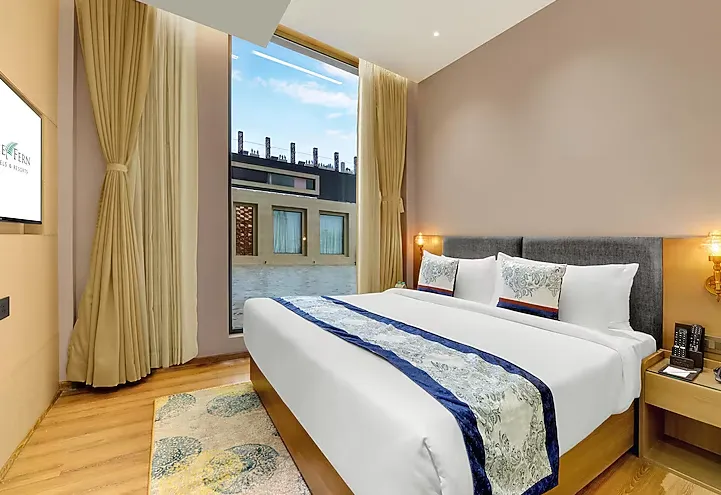 Hazel Suite room at Rajawat The Fern - An Ecotel Hotel, Kanpur featuring separate seating space and organised layout