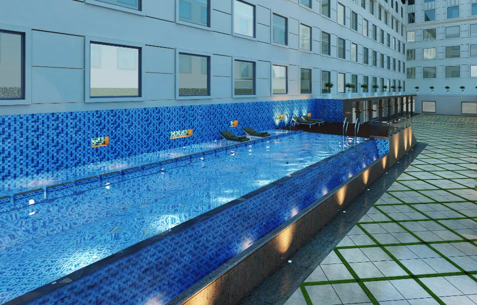 Swimming pool at Ramada by Wyndham Lucknow Hotel and Convention Center with deck area and clear water