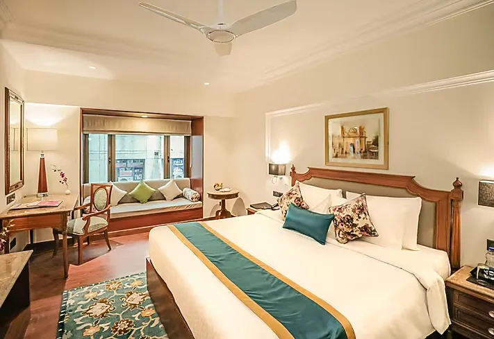 Executive Double room at Regenta Central Lucknow with neatly arranged bed, work desk, and soft lighting