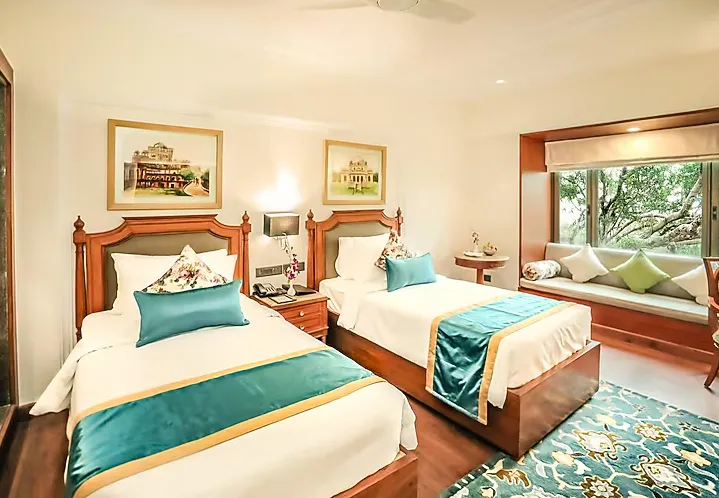 Executive room at Regenta Central Lucknow showing extra seating space and modern interior finish