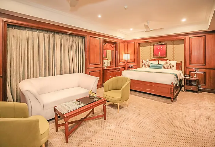 Premium double room at Regenta Central Lucknow featuring spacious layout and refined furniture design