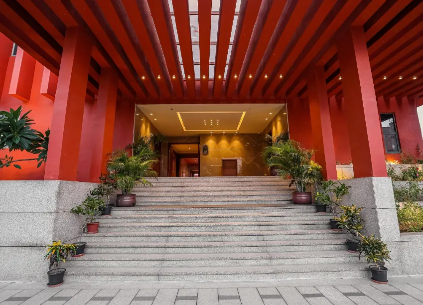 Front entrance of Regenta Gulab Kothi Varanasi displaying signage, driveway access, and exterior façade