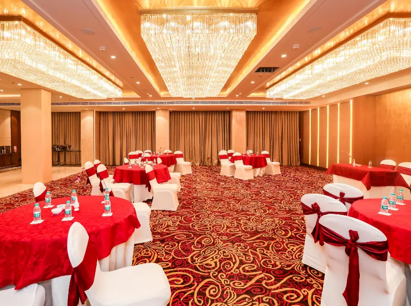 Restaurant at Regenta Place Jhansi Gorakhpur displaying dining tables, chairs, and well-lit interior space