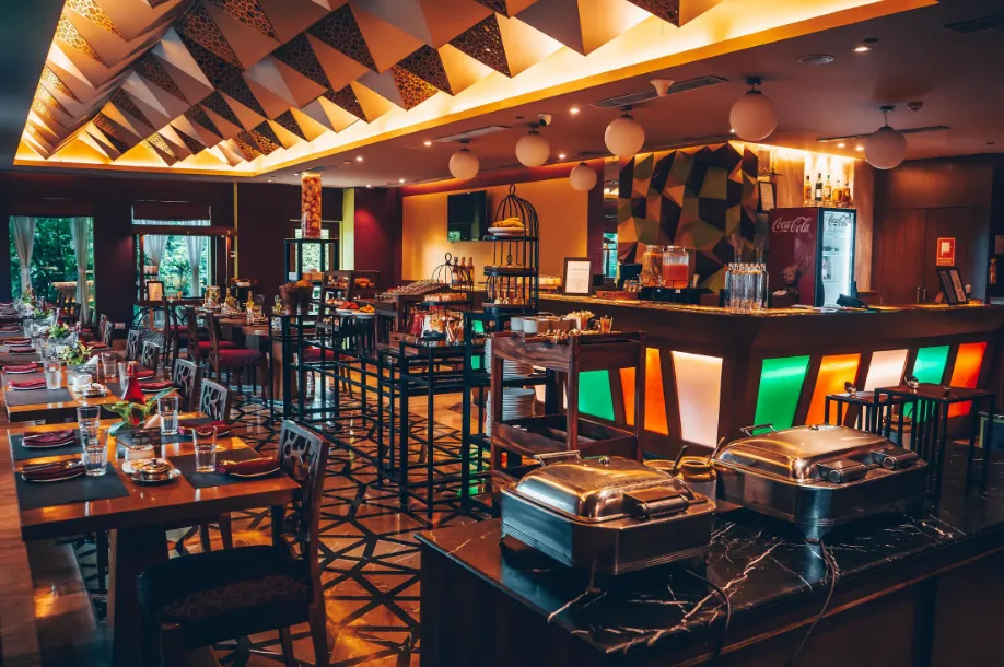 In-house restaurant at Regenta Orko’s, Kolkata with a comfortable dining setup