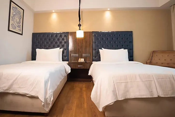 Premium room at Sarovar Portico Jaipur with upgraded interiors, seating space, and modern layout