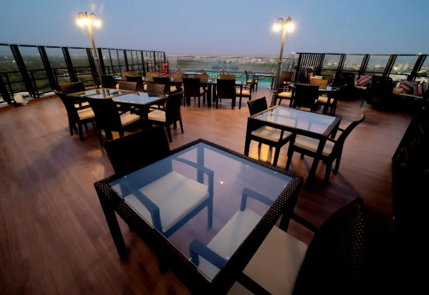 Restaurant at Sarovar Portico Jaipur showing dining tables, interior setup, and service area