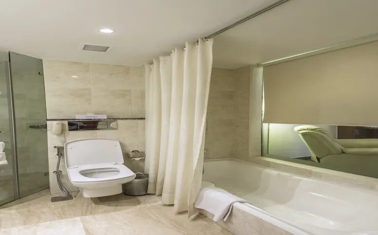 Suite room at Sarovar Portico Jaipur featuring separate living area and extended space