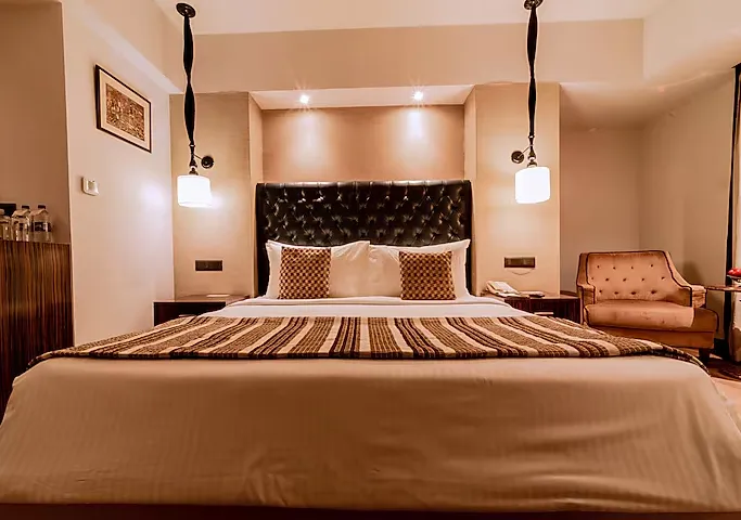Superior room at Sarovar Portico Jaipur with comfortable bedding and practical room design