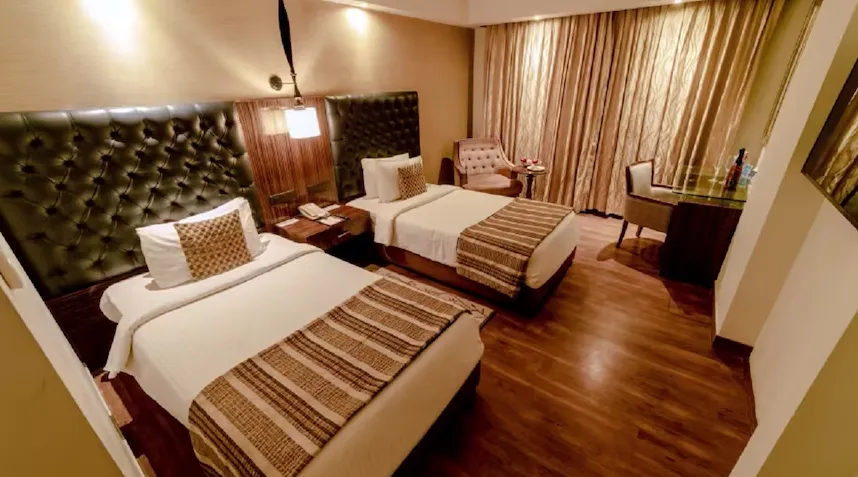 Superior room at Sarovar Portico Jaipur with comfortable bedding and practical room design