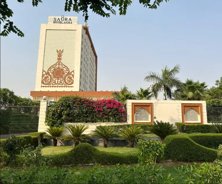 Hotel entrance of Saura Hotel, Agra - A Club Mahindra Associate showing façade and arrival area