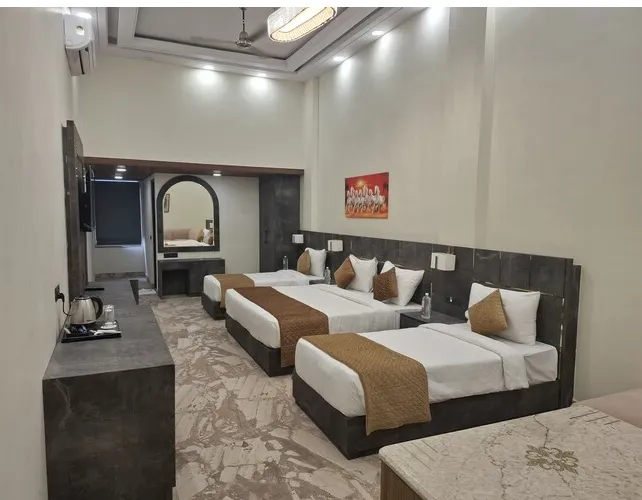 Suite room at Shrigo Hotels Banaras Varanasi featuring separate seating space and comfortable room layout